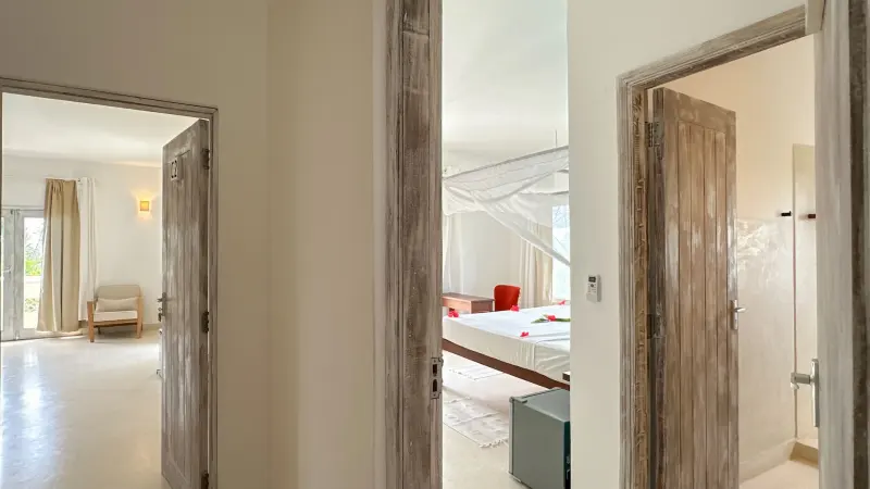 Looking through the hallway into a bedroom