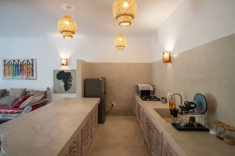The open kitchen with brass lanterns